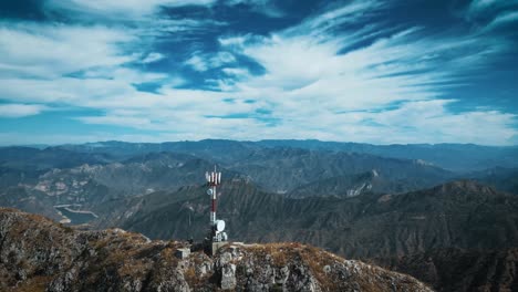 a stunning drone shot over the top of a mountain ridge in mexico