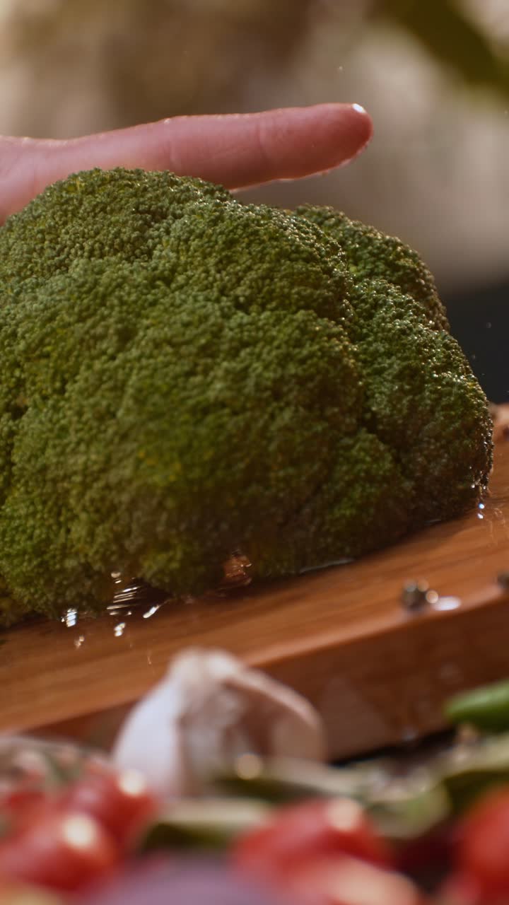 Preparing fresh broccoli and vegetables for cooking