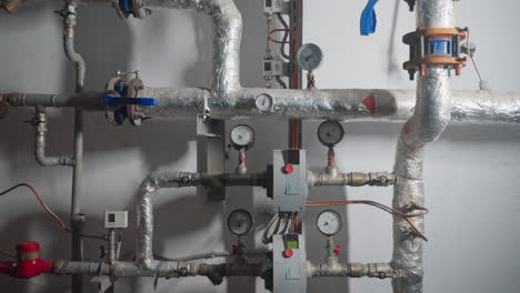 pipeline with insulation and gauges in mechanical room