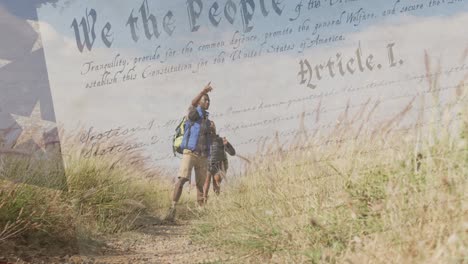 animation of american flag over diverse couple hiking in mountains