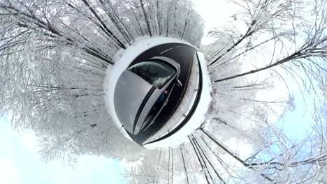 car is driving through winter forest, 360 degree, little planet effect