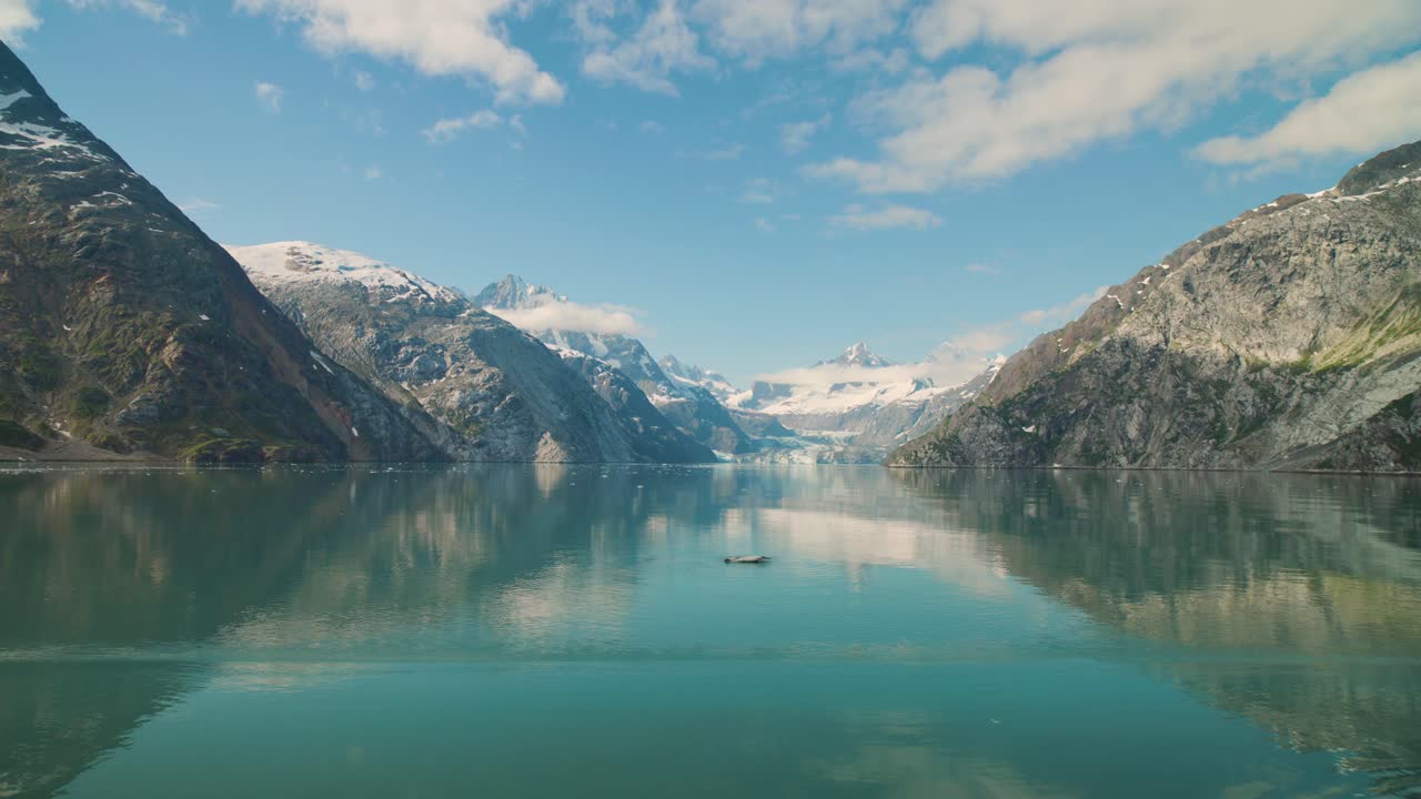 Beautiful mountains in Glacier Bay, Alaska seen from a moving ship. For projects requiring longer clips in higher resolution, visit StockPlates.