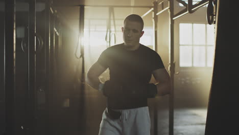man preparing for boxing training in a gym