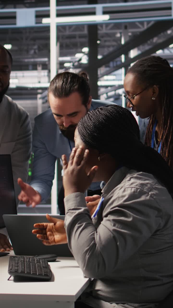 Vertical video Engineering team in data center panicking after receiving critical error popup