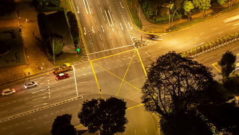singapore - 3 march 2025 : timelapse of the singapore city skyline and traffic on the roads at night