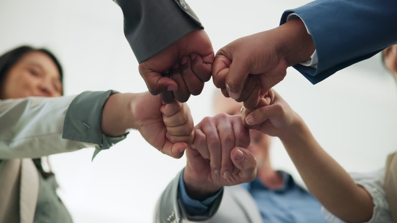 Diverse Business Team Showing Unity with a Fist Bump Huddle