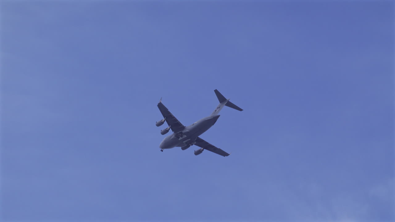 Antibes, France - May 8, 2025: View of an airplane flying on the cloudy sky in the evening