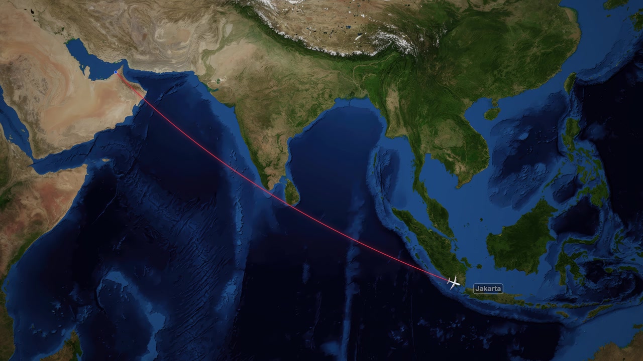 Airplane icon follows a red line across a satellite map from Dubai to Jakarta