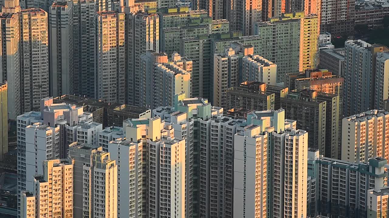 Overlooking the dense apartment buildings in Kowloon, Hong Kong, this aerial urban view captures the incredible city density and vertical architecture that define the city’s landscape