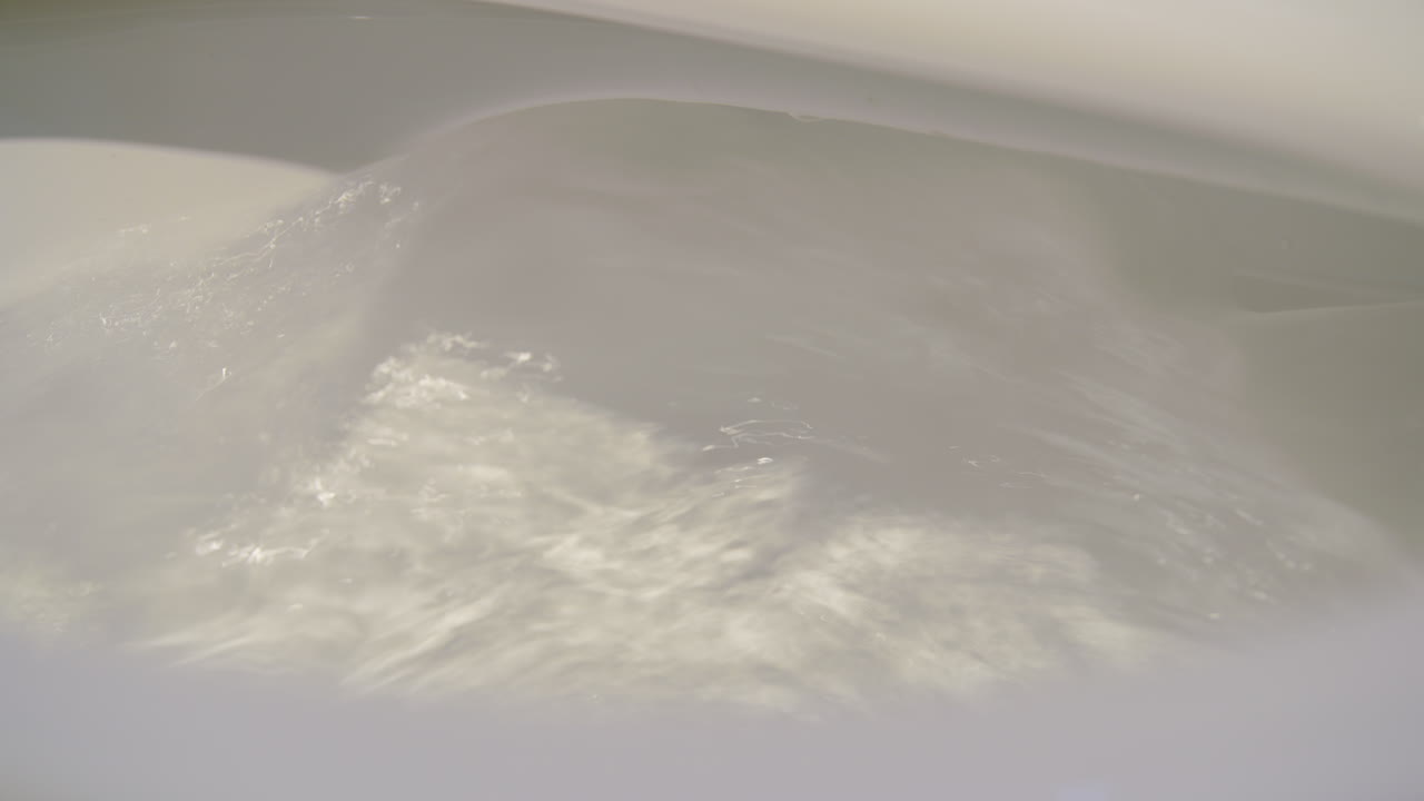 Tight Shot Of A Toilet Flushing