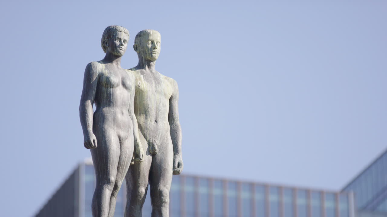 Sun and earth man and woman sculpture by Palehaven, Oslo