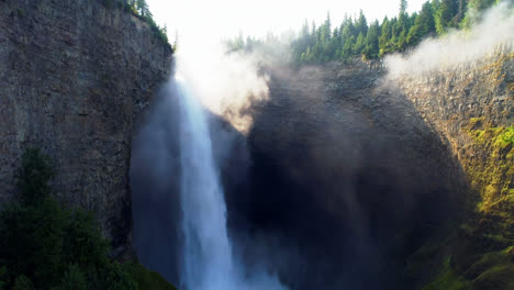 beautiful water fall through cliff 4k