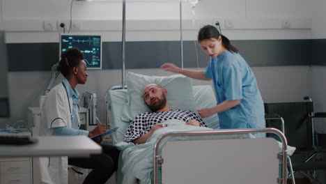 patient talking with medical doctors while sitting in bed during disease recovery