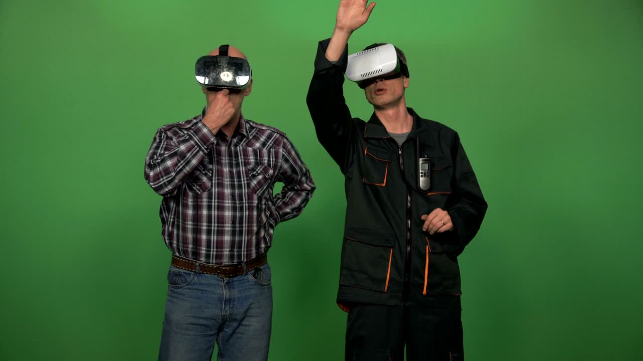 Two men putting on VR headsets