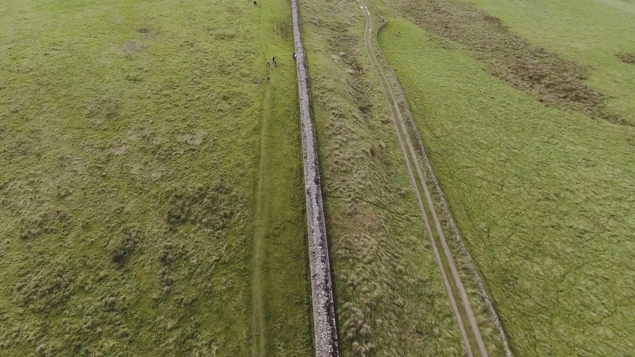 Top View Of The Ancient Hadrian's Wall In Scotland During Daytime - Aerial Drone Pullback