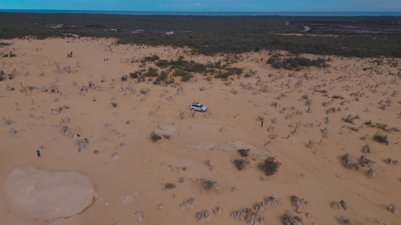 Aerial footage of a vehicle in the Pinnacles Desert