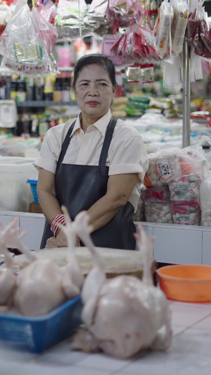Woman selling chicken at a market