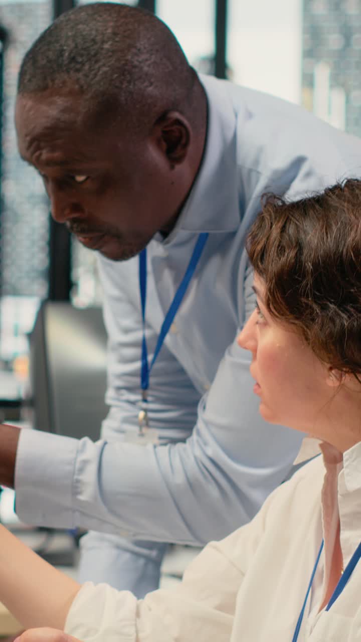 Vertical video Manager supervises intern in startup office using artificial intelligence