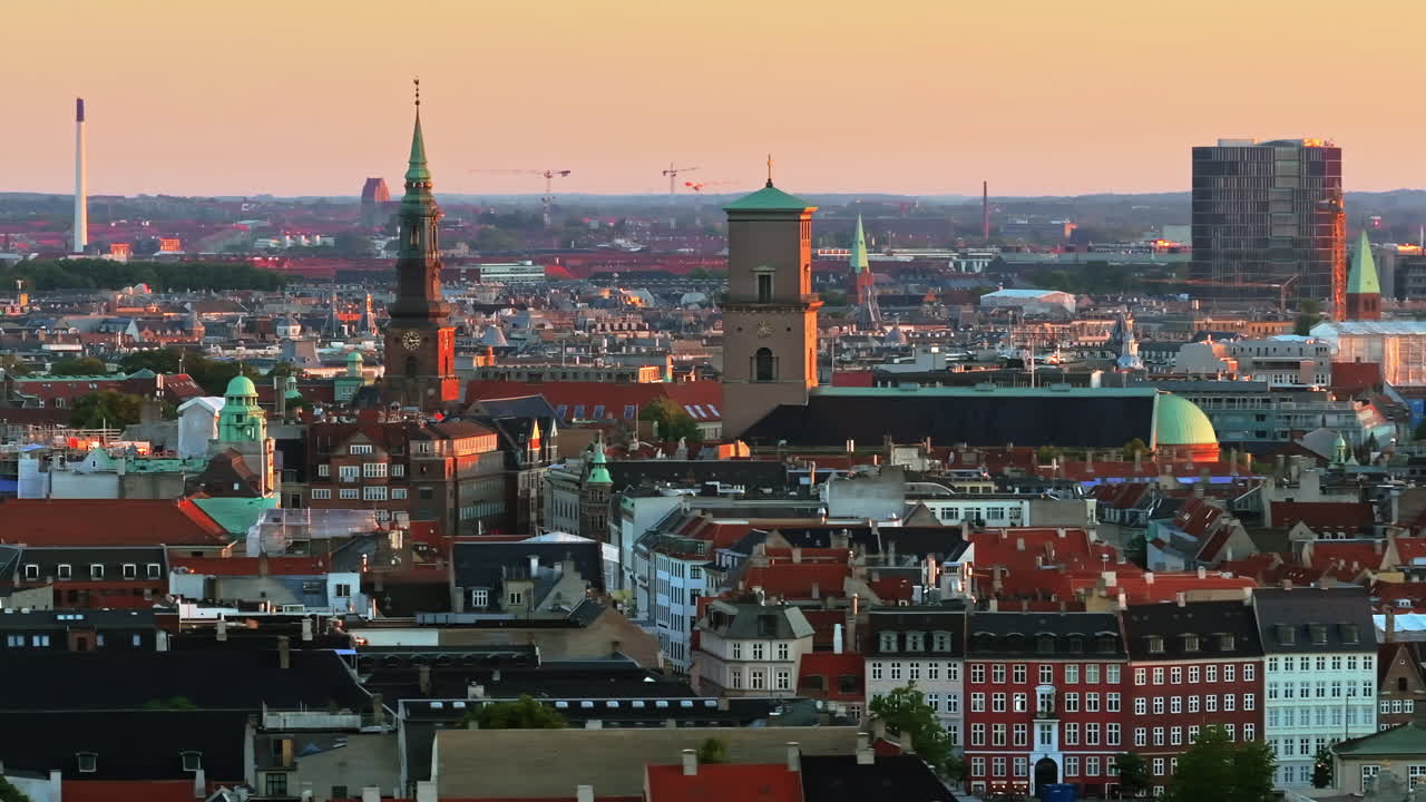 Aerial drone view of the city centre of Copenhagen, Denmark at sunset