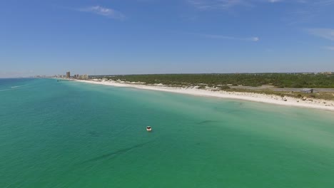 boat anchored in blue water off mexico city beach florida coast on sunny day