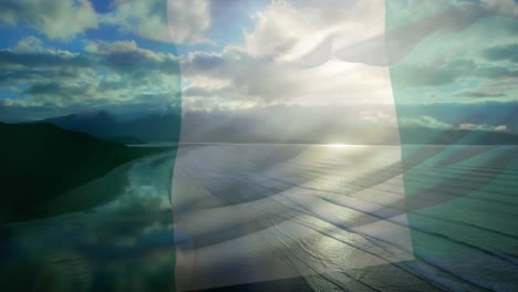 digital composition of waving nigeria flag against aerial view of beach and sea waves