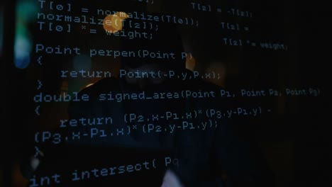 animation of data processing over caucasian male computer hacker in balaclava using laptop