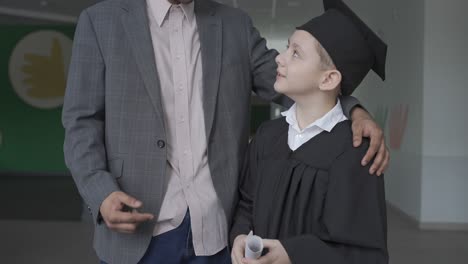 teacher hugging his student.