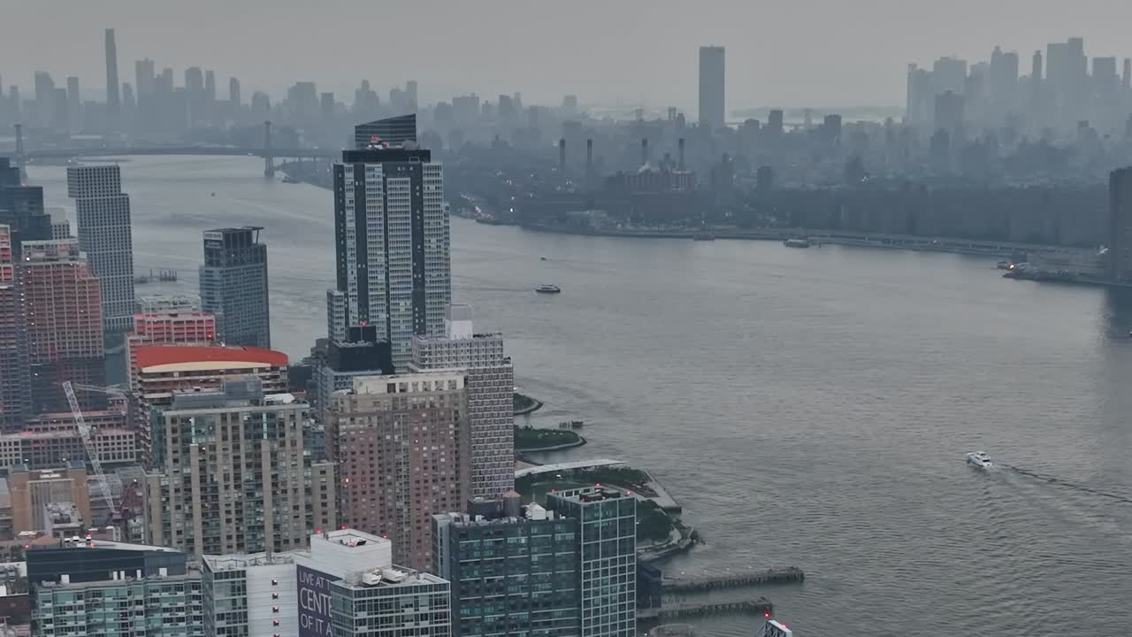 Drone view of New York City skyline over the East River on a cloudy day