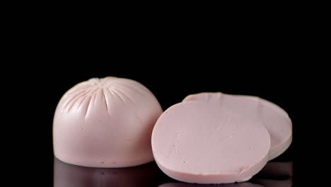 pieces of boiled sausage on the table slowly rotates.