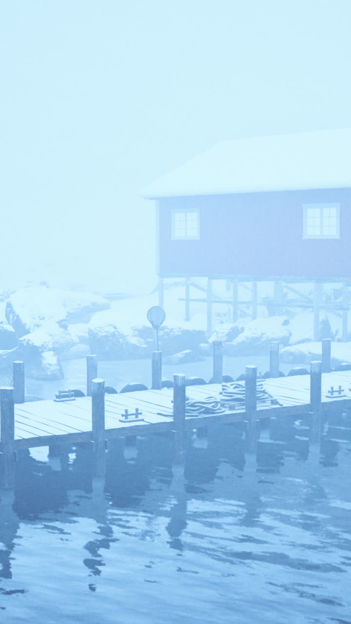 Foggy day dock with house on old wooden pier in the norwegian sea