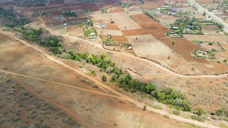 aerial farms and buildings in a beautiful rural landscape in kenya