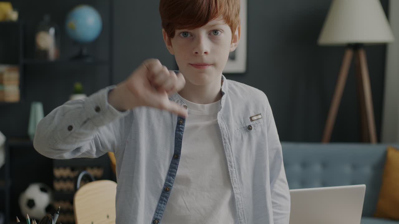 Boy Pointing Down