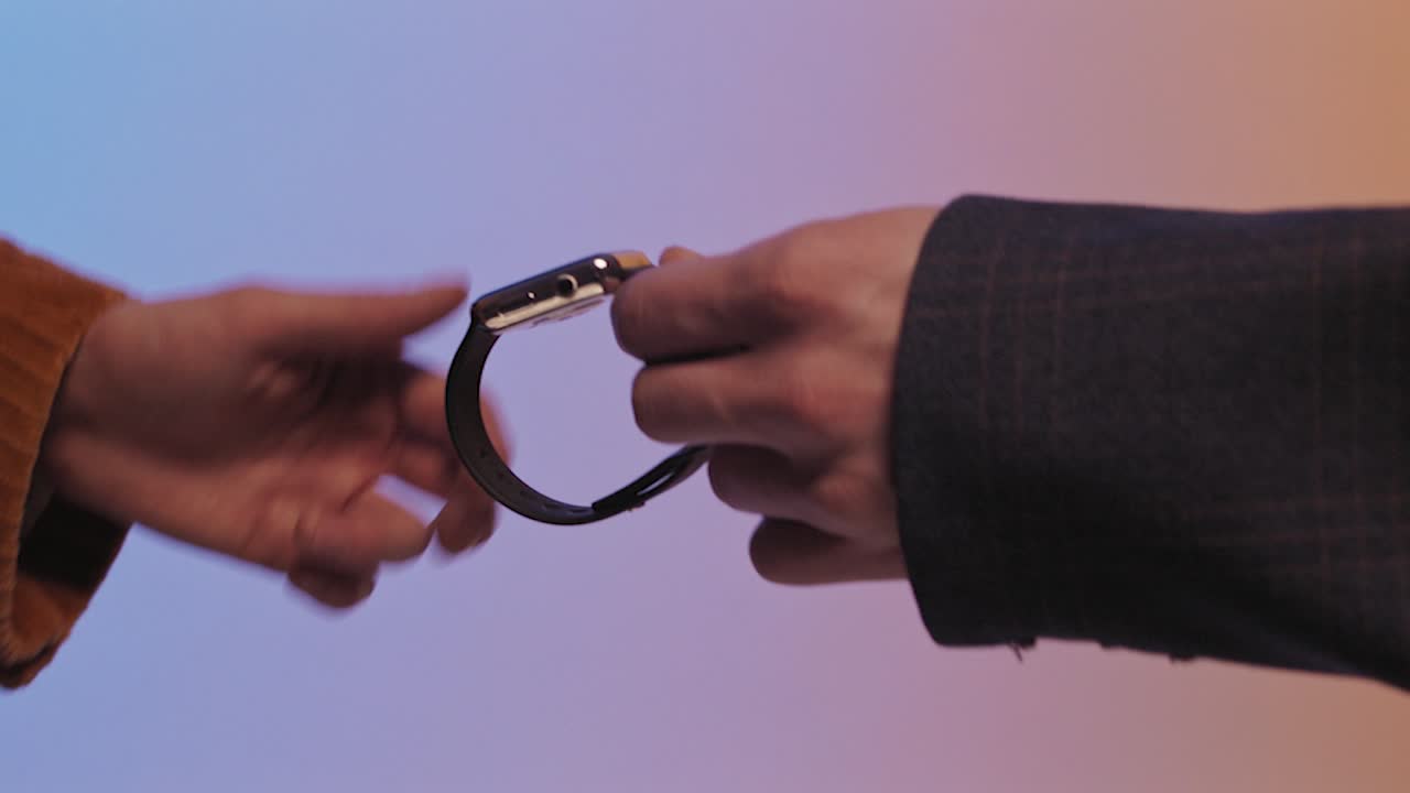 Hands Exchanging a Watch and a Decorative Pot
