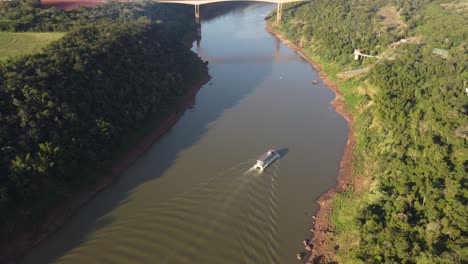 aerial view of a tourist boat sailing on the iguazu river