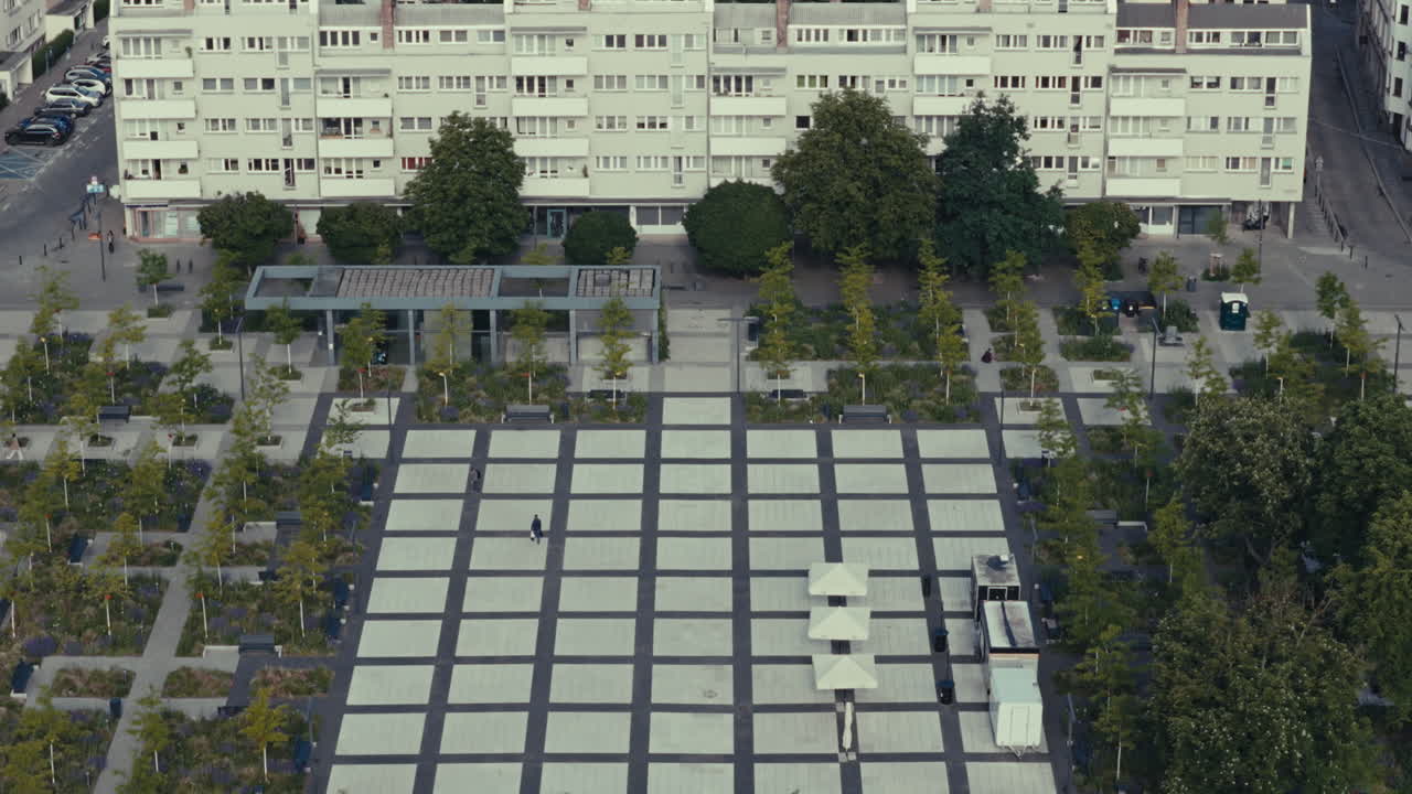 Aerial View of a City Square with Modern Buildings and Park