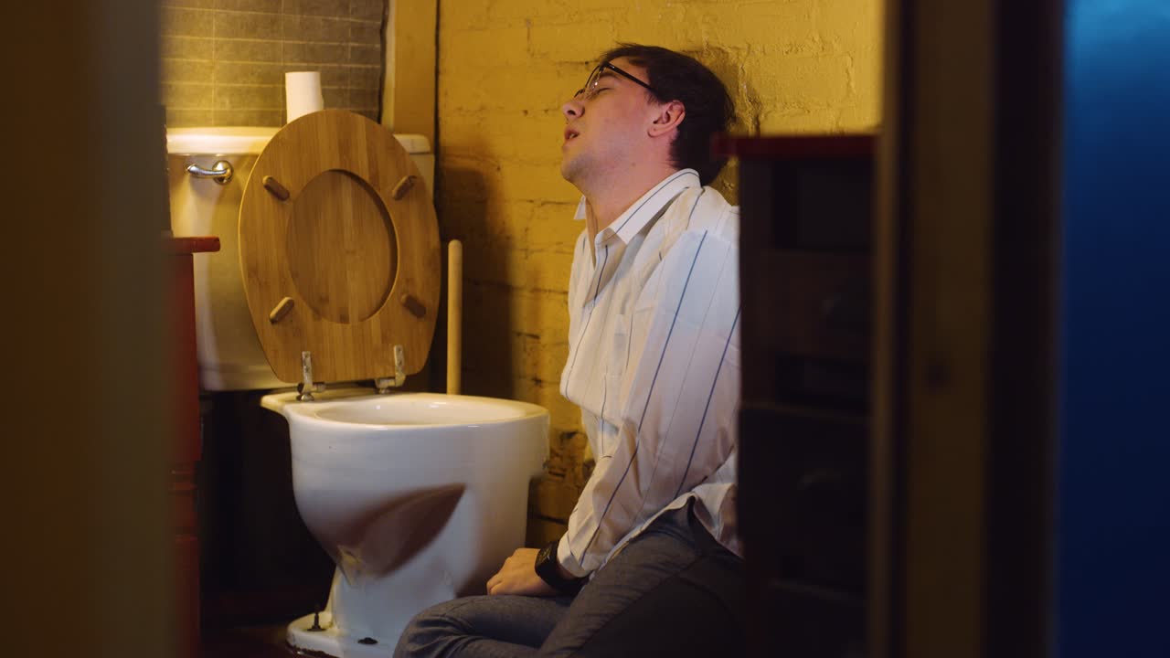 Man runs in and throws up in bathroom