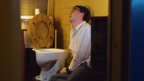 man runs in and throws up in bathroom