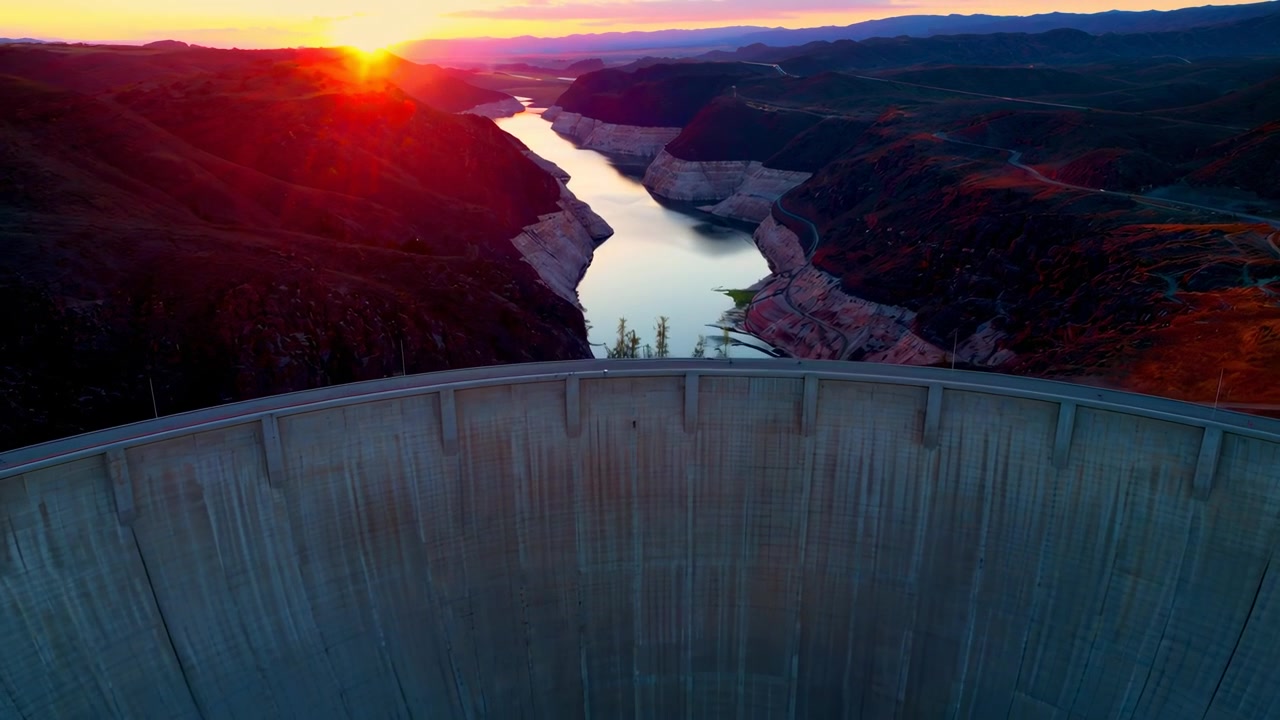 Aerial View of a Concrete Dam at Sunset