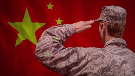 Animation-of-flag-of-china-over-caucasian-male-soldier-saluting