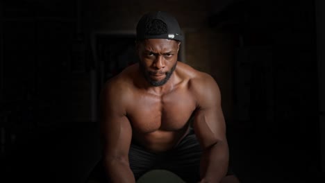 Shirtless-Muscular-Man-Does-Workout-on-the-Battle-Rope-In-a-Fitness-studio