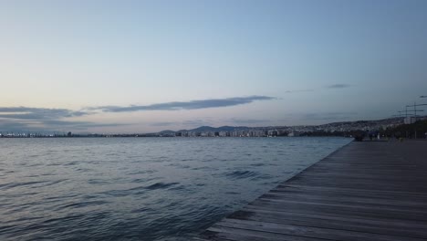 Steady-clip-of-the-sea-on-the-port-of-Thessaloniki-in-northern-Greece,-at-sunset