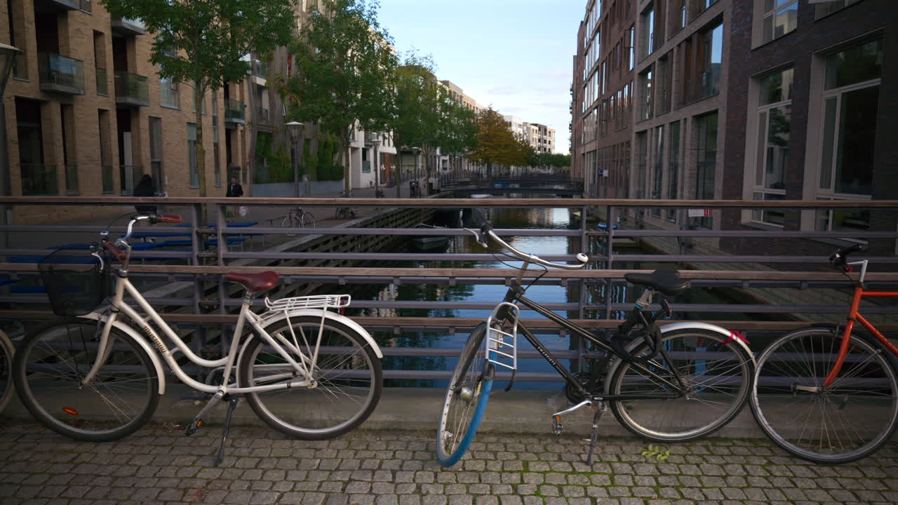 Bicycles standing near a canal in the Teglholmen island in the South Harbour of Copenhagen, Denmark