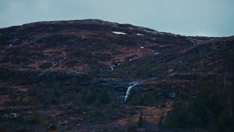 mountain and waterfall in åfjord, norway - wide shot