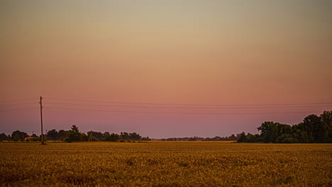 nightfall over farmland the a new super moon rising over the countryside - time lapse