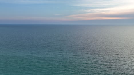 water off the coast of florida on a cloudy sunset day with no man made structure in site