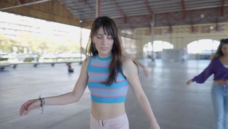 group of young women roller skating in a park
