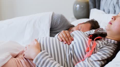 pregnant woman sleeping on bed in bedroom 4k