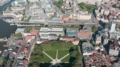 Dolly-back-pan-up-drone-shot-of-vibrant-central-Bristol-City-UK