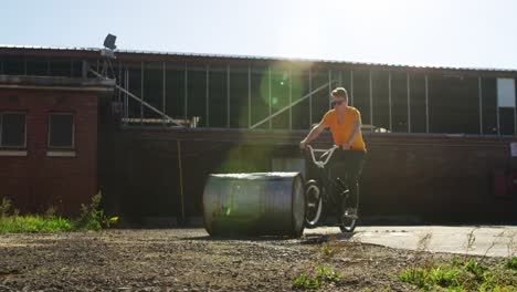 BMX-rider-doing-trick-in-an-empty-yard