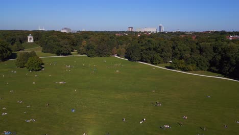 Fantastic-aerial-top-view-flight-summer-sunbathing-lawn-in-the-park-English-Garden-Munich-Germany-Bavarian,-summer-sunny-blue-sky-day-23